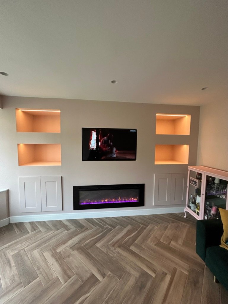 Completed interior feature wall with lit alcoves and fireplace